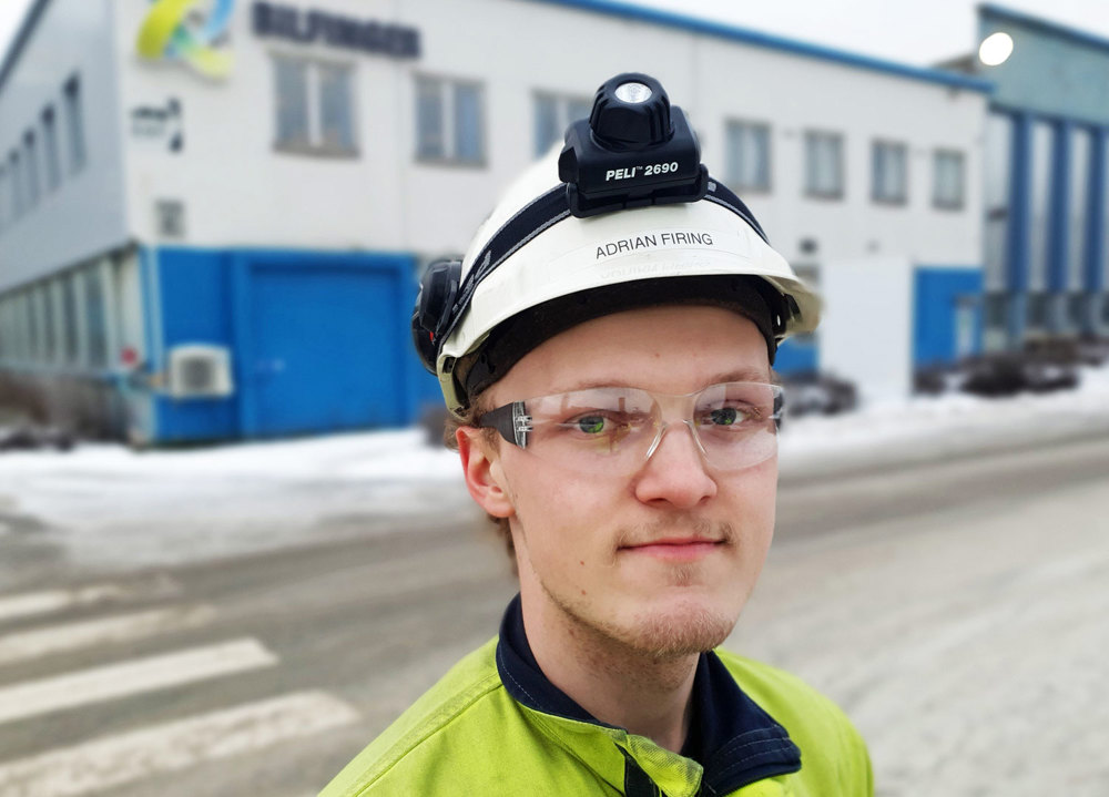 portrait young male apprentice, industry, outdoors