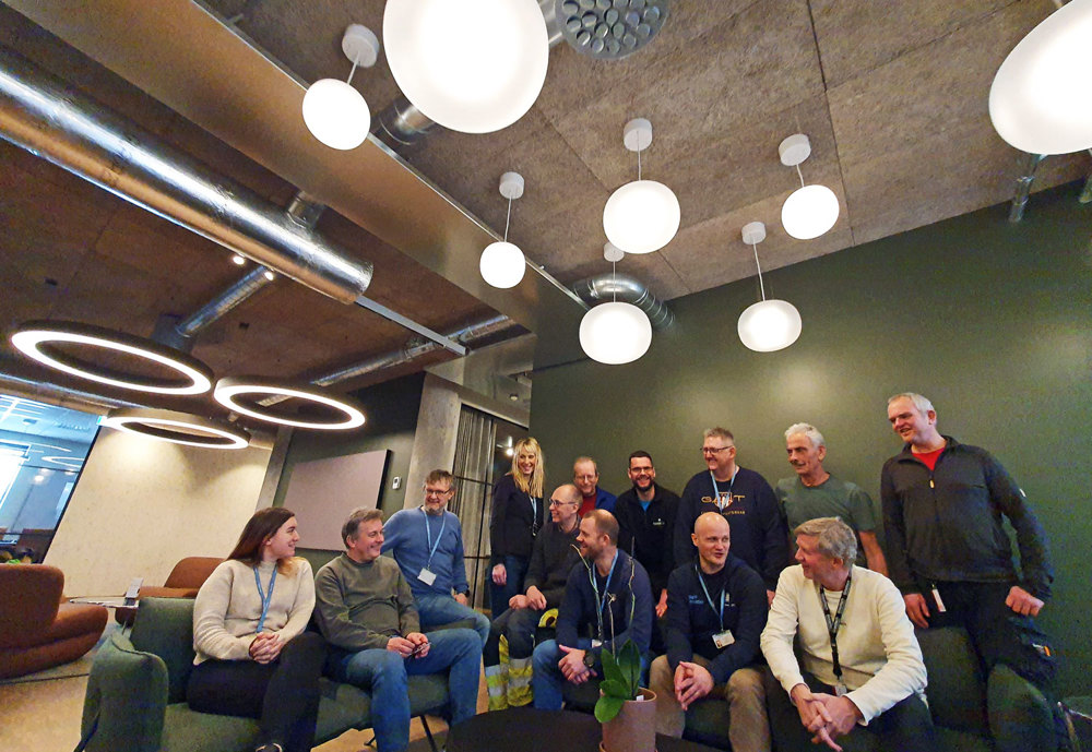 group of people, sitting and standing together, chatting