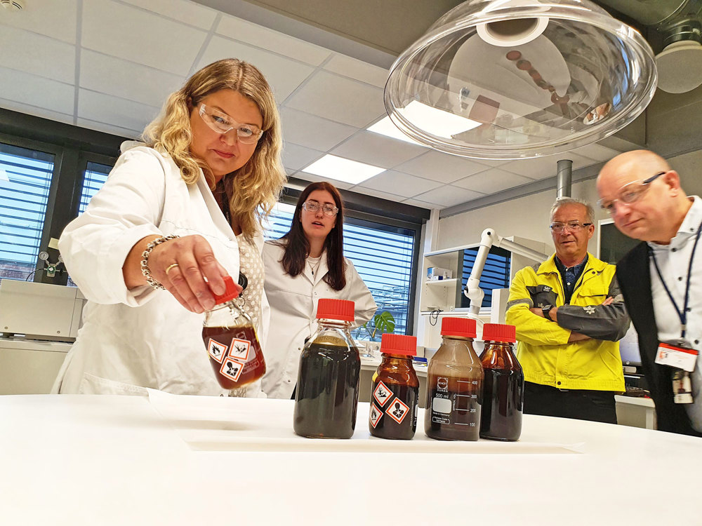 studying oil samples in small bottles