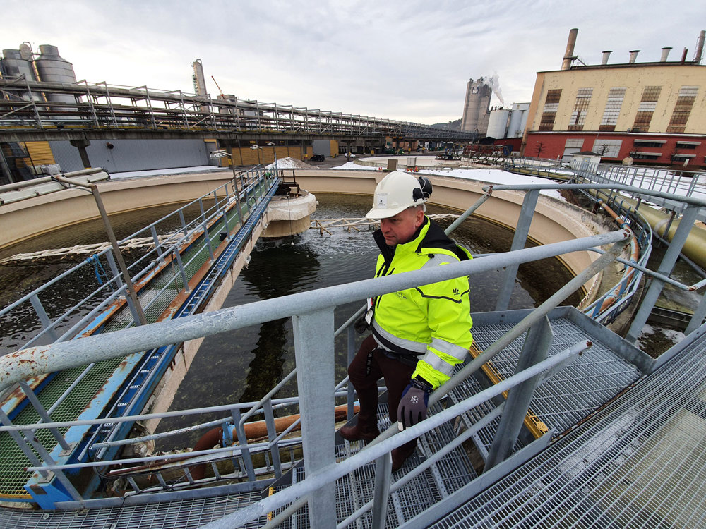 man walking down stairs, outdoors, industry