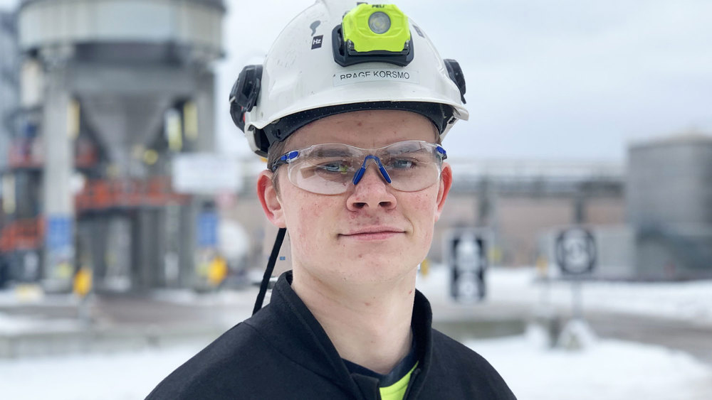 portrait young male apprentice, outdoors, industry,