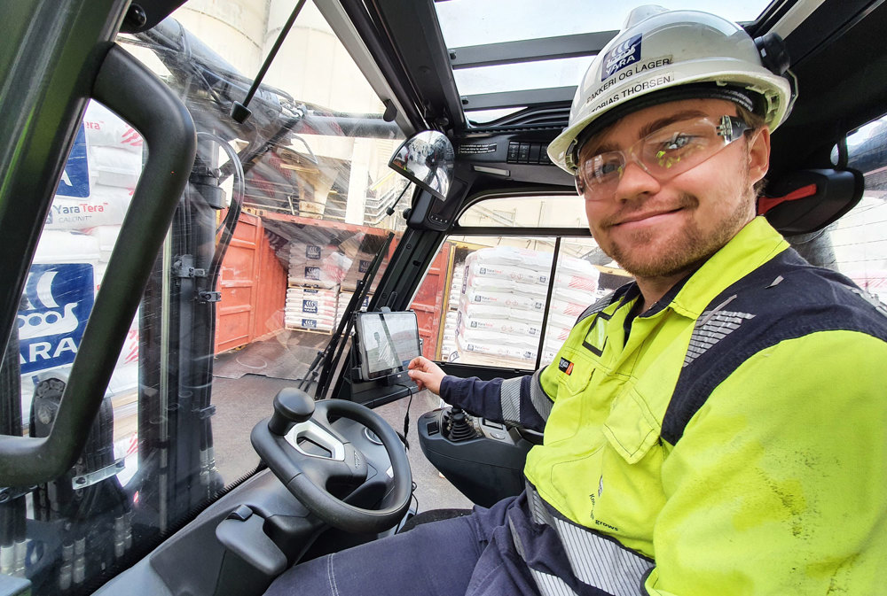 man sitting in a truck lift