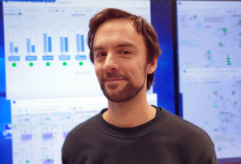 portrait of man in front of monitor