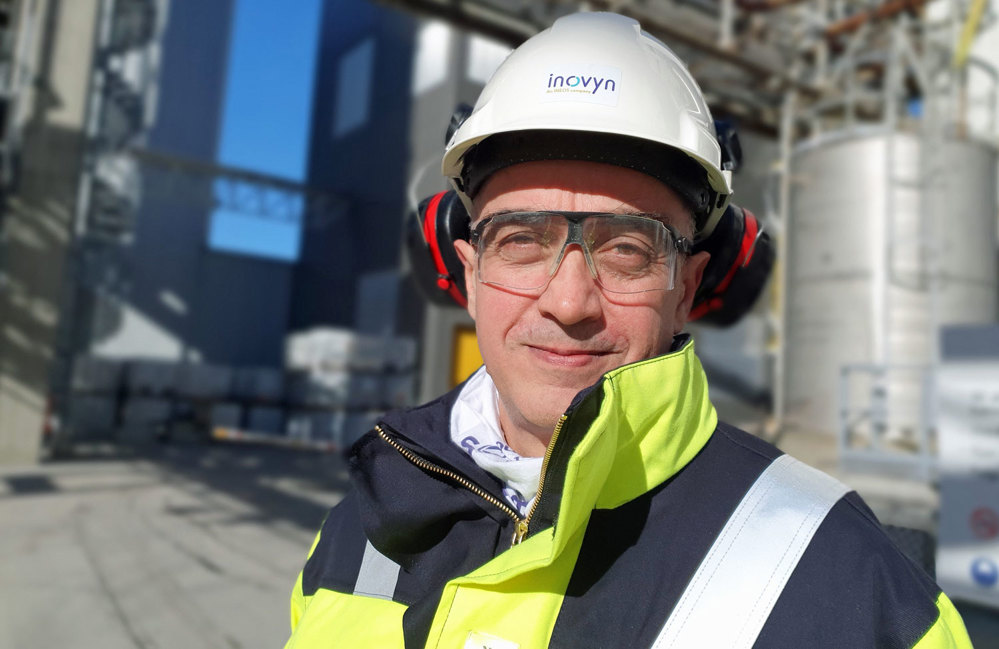 man, posing, portrait, wearing working clothes, white helmet, industry