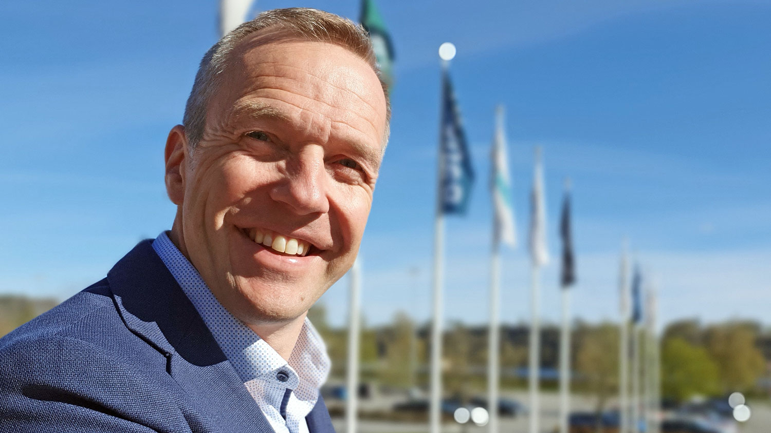 portrait of man, outdoors, flags